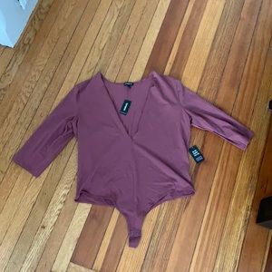 Brand new long sleeve body suit